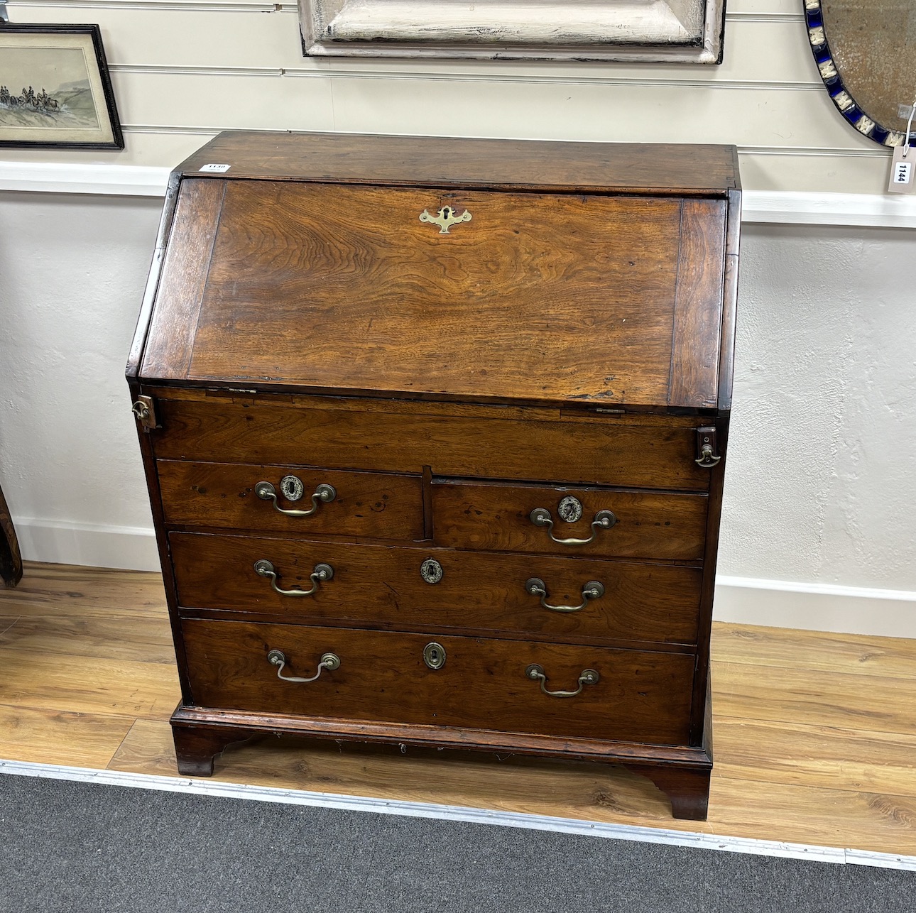 A George III red walnut bureau, width 84cm, depth 51cm, height 95cm